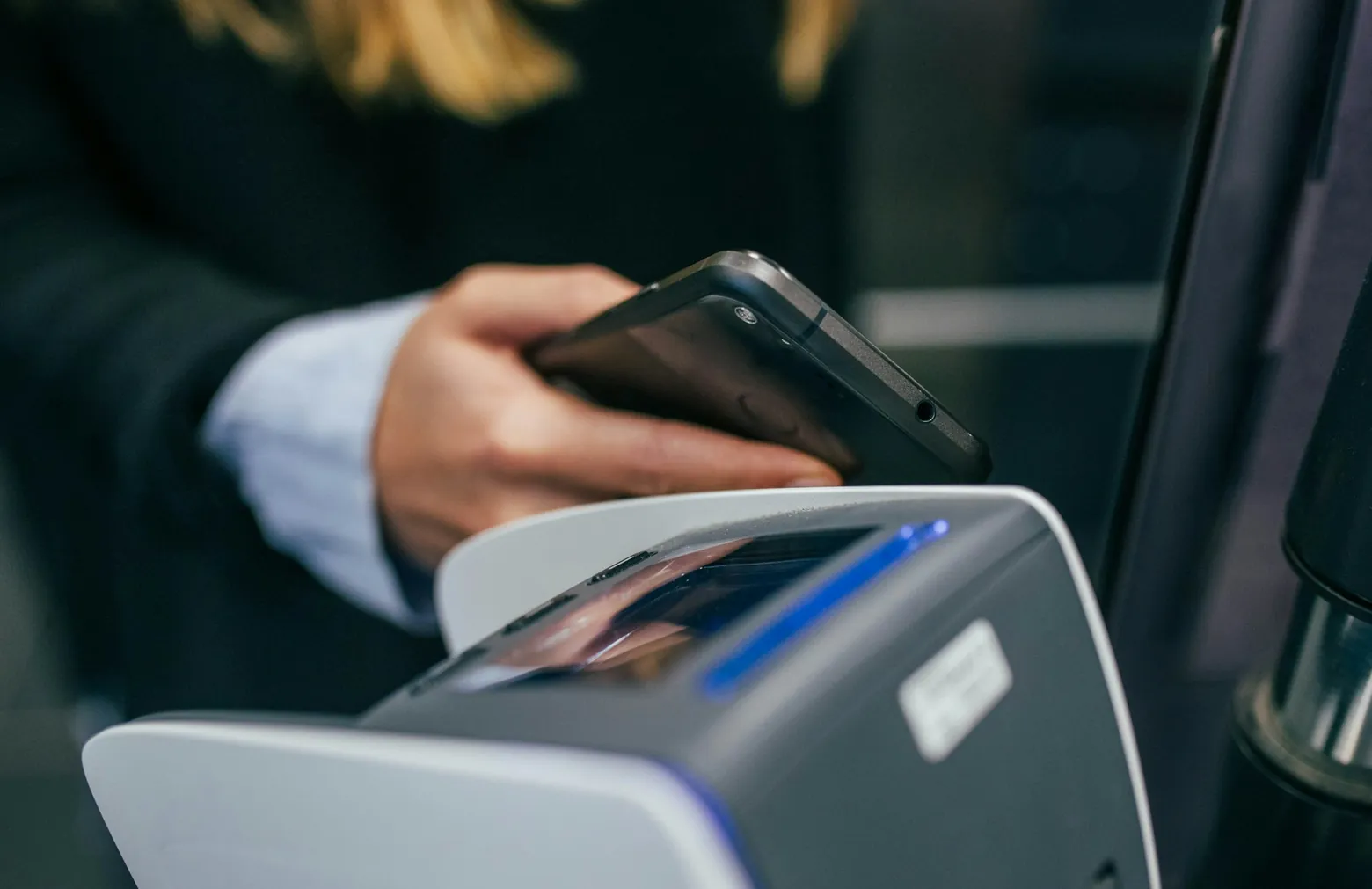 Phone being tapped on a payment terminal